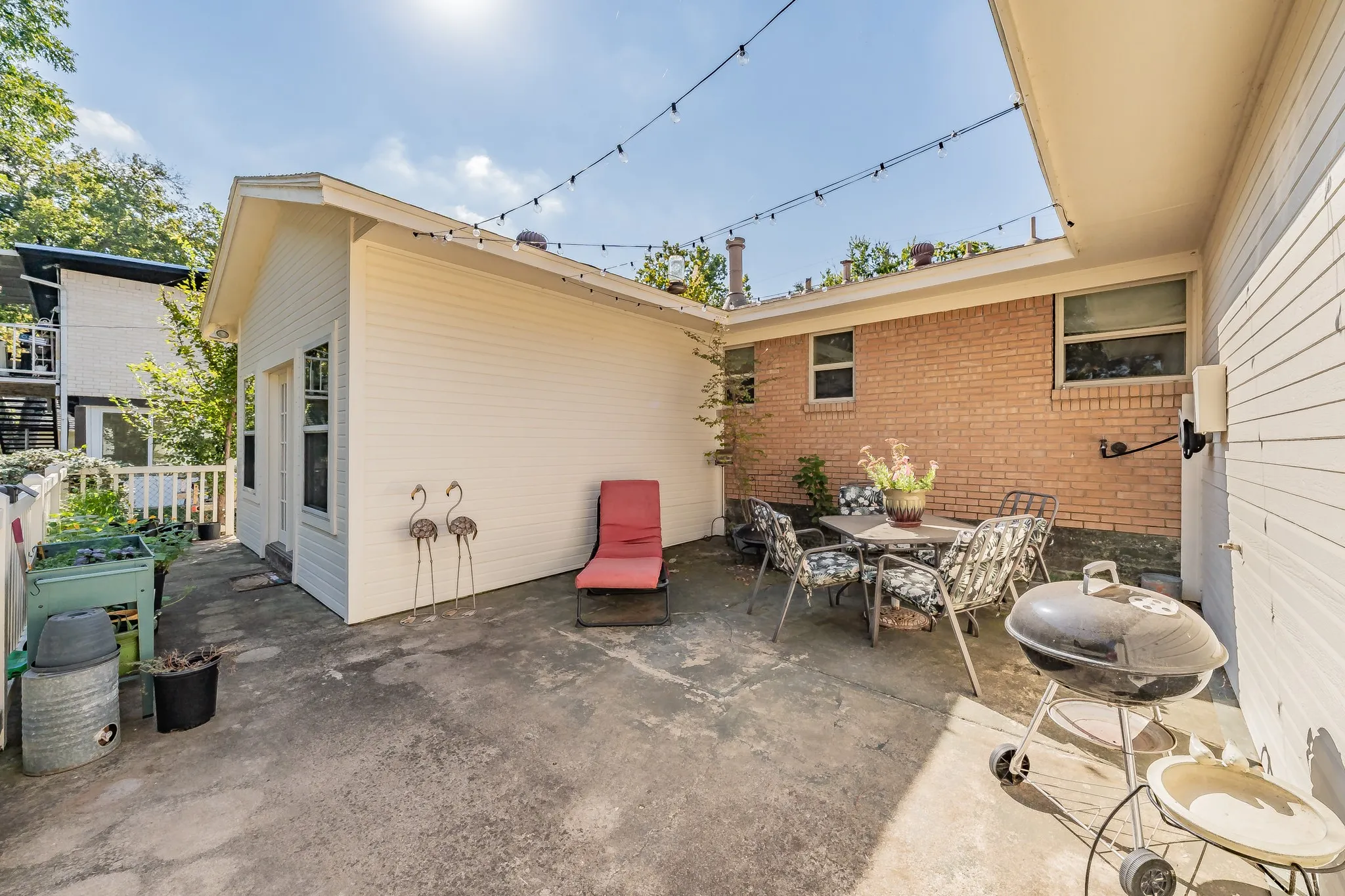 View of patio featuring a grill and outdoor dining space