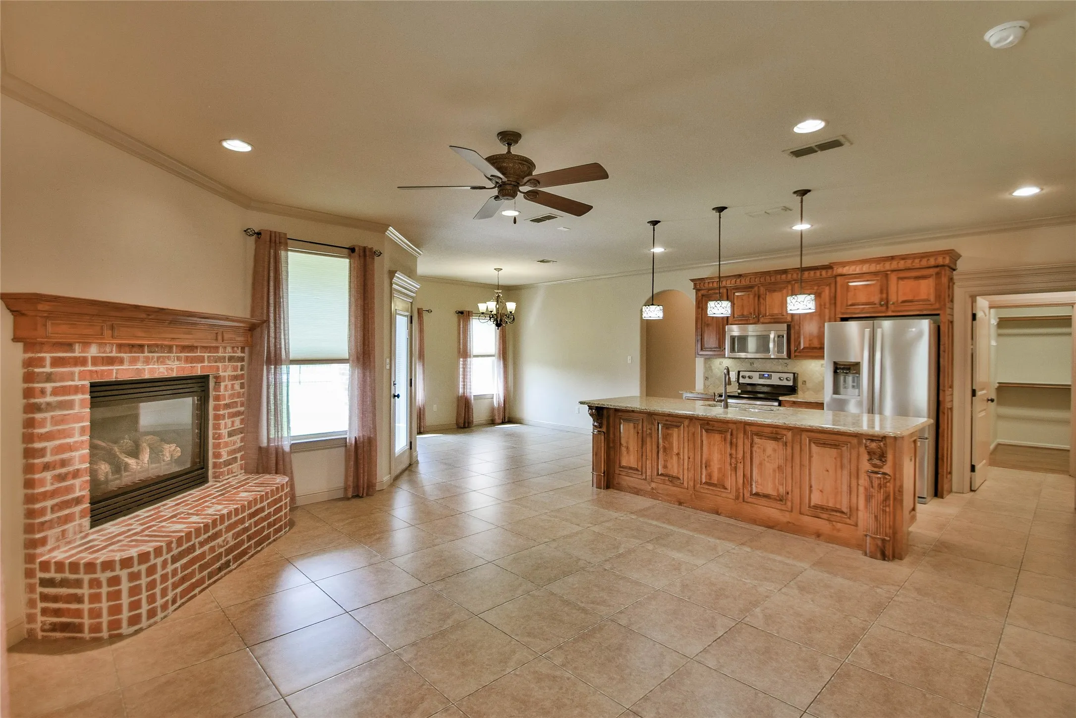 Living room looking towards kitchen and dining area