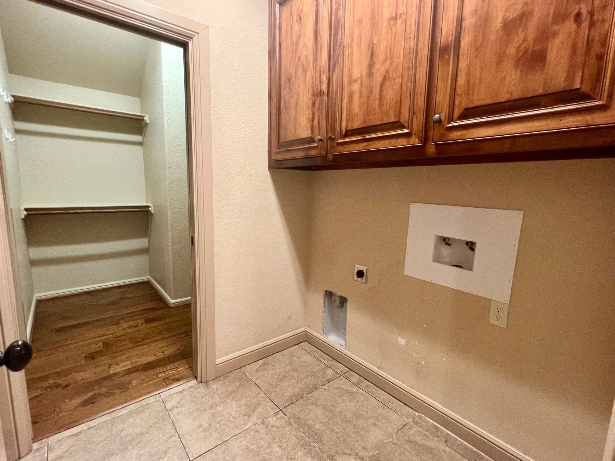 Laundry room just off the primary closet