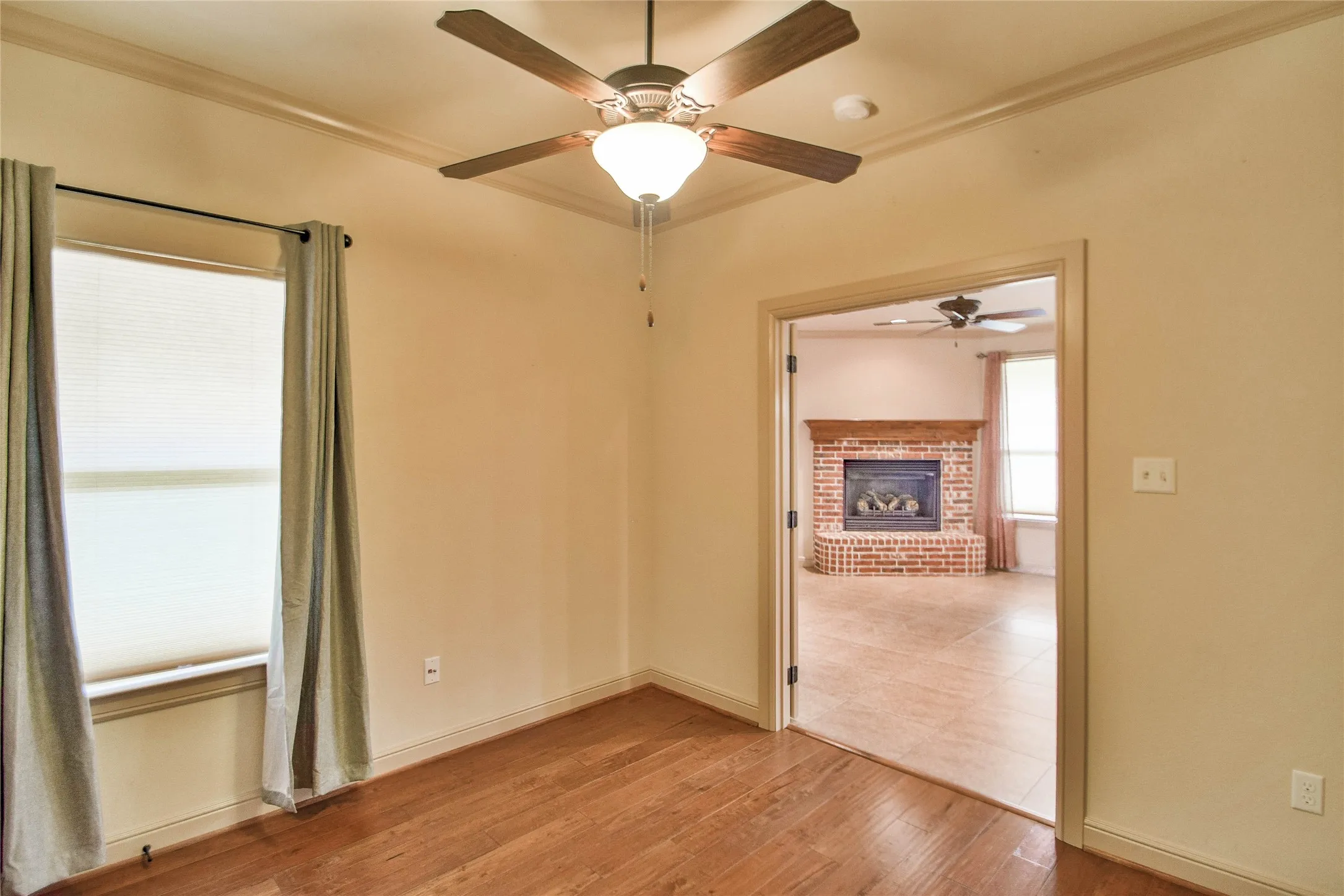 3rd bedroom or study with wood flooring
