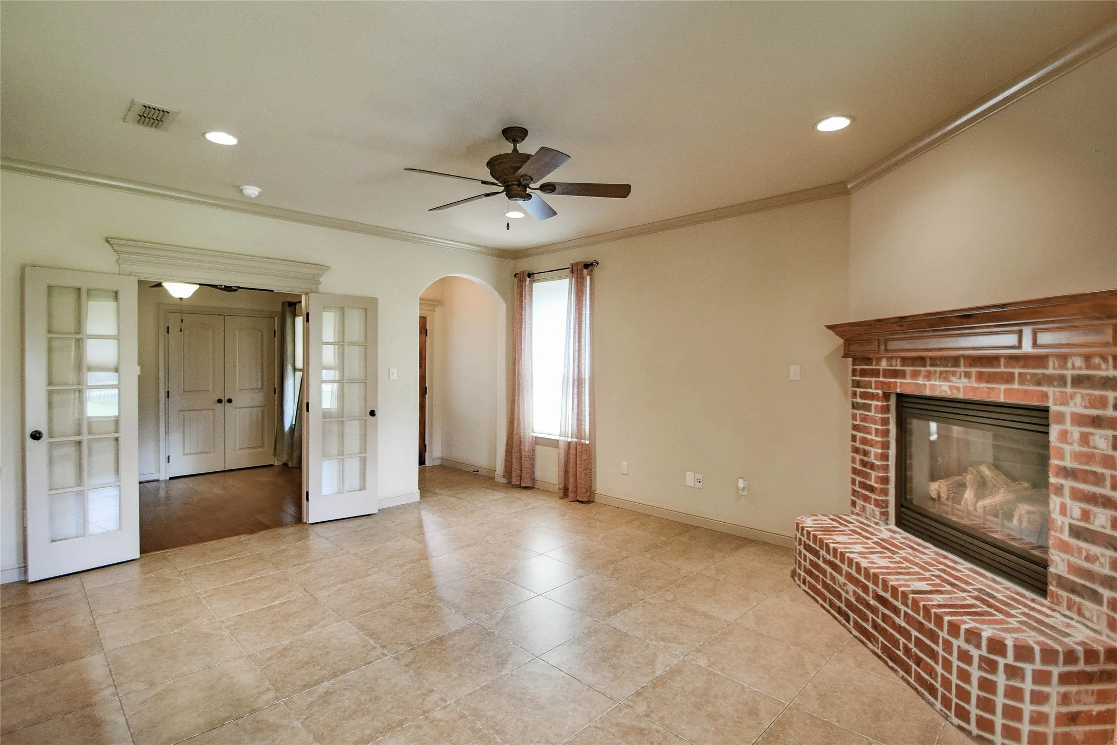 Living area looking toward entry and 3rd bedroom or study