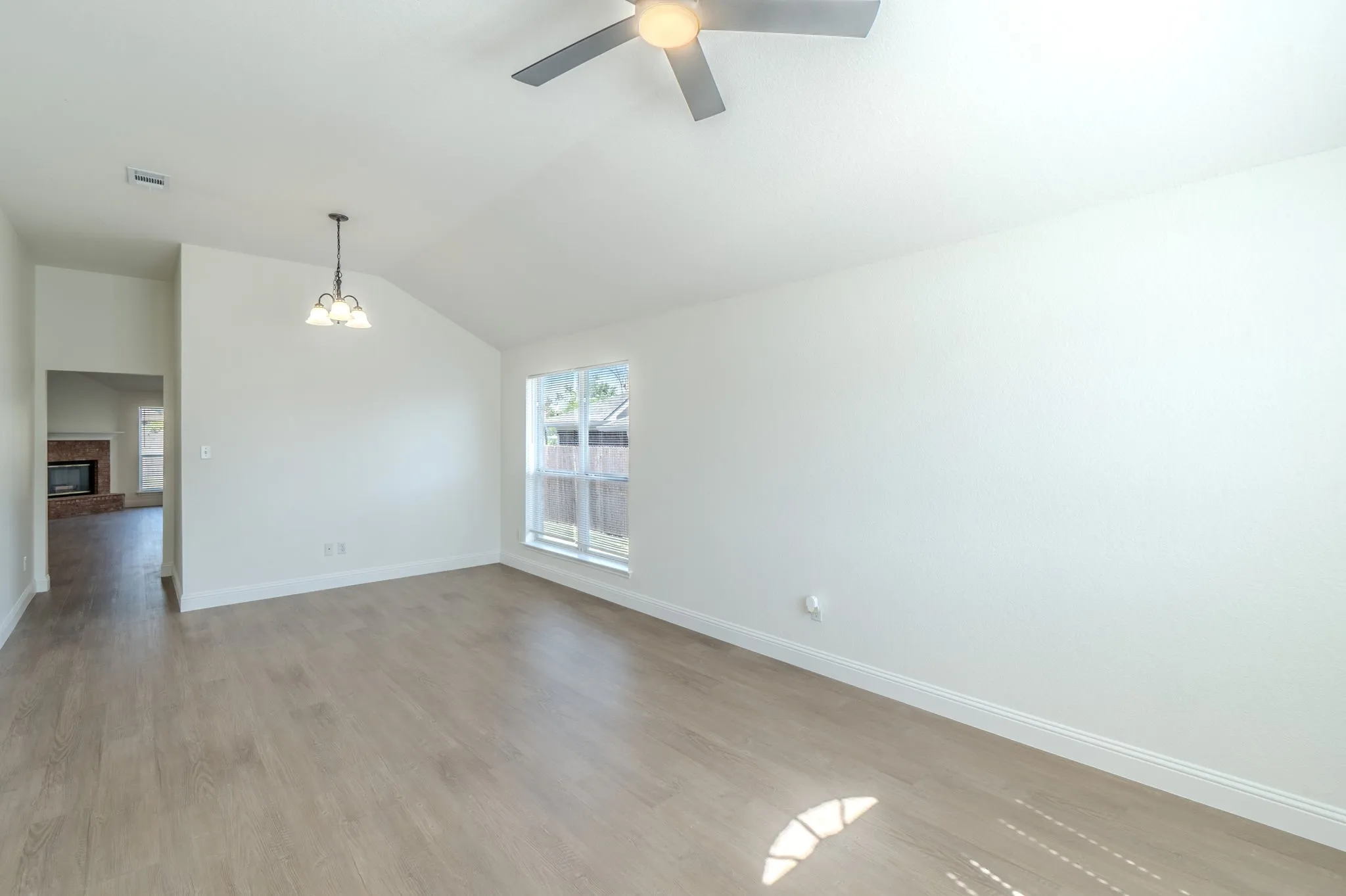 Front Entry of home. LVP flooring throughout. Area can be used for dinning or another living room area.