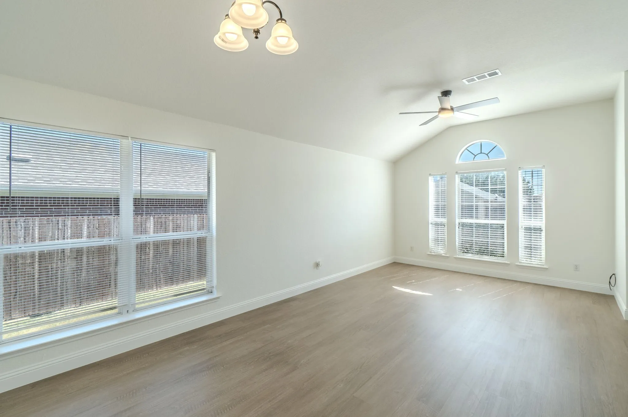 Front Entry of home. LVP flooring throughout. Area can be used for dinning or another living room area.