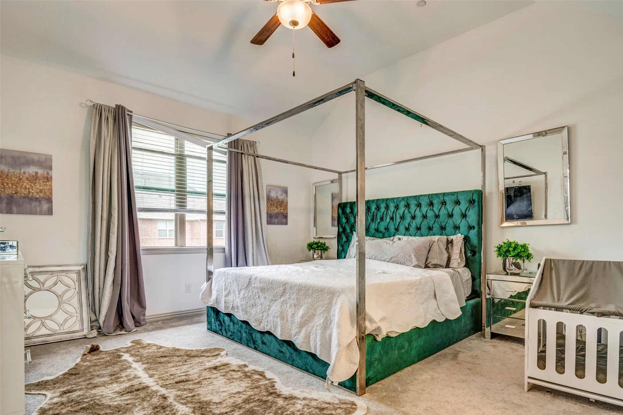 Bedroom featuring vaulted ceilings and a ceiling fan