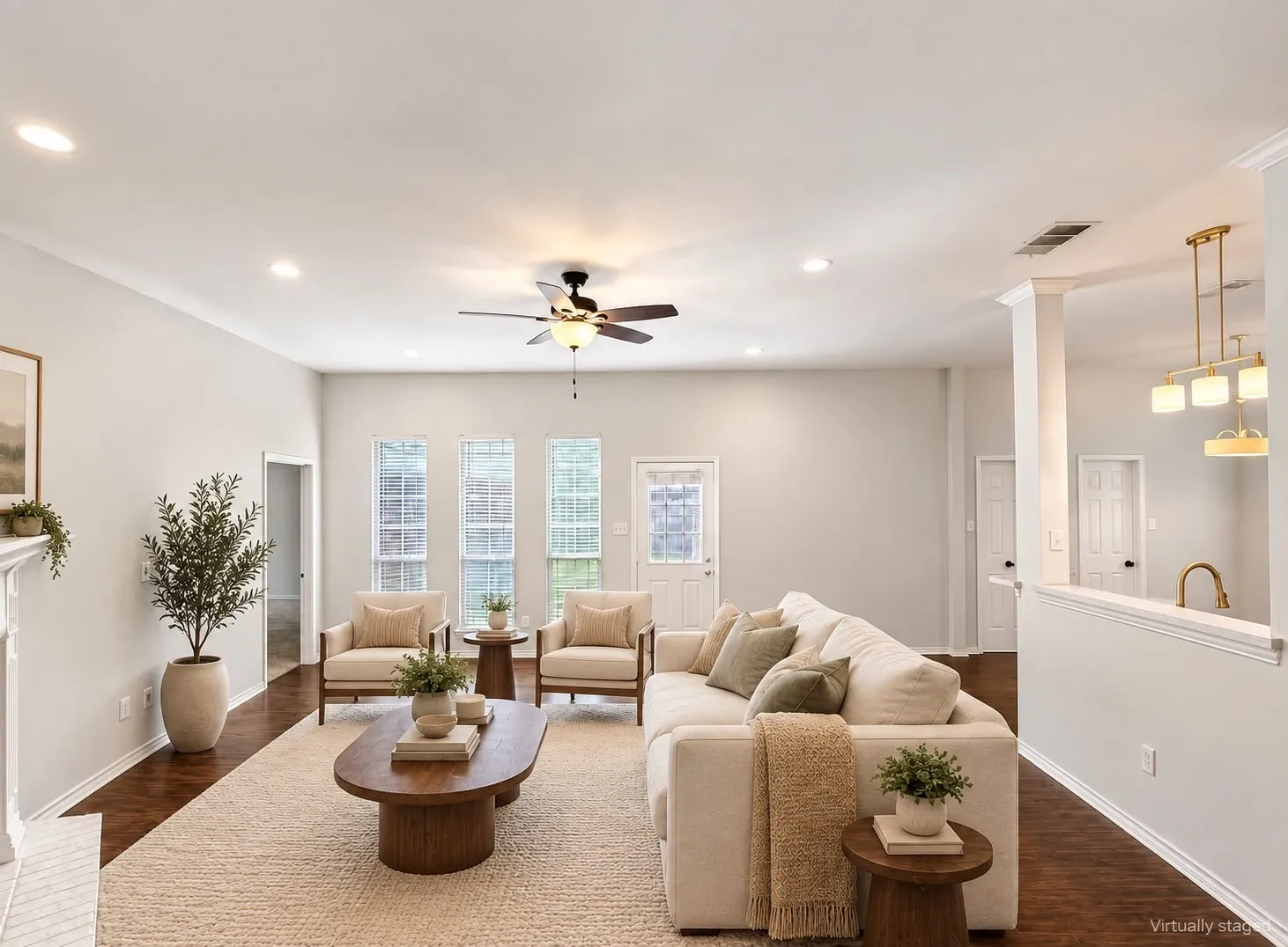 Recessed lighting, crown molding, wood-finish flooring, ceiling fan, and a half-wall with a decorative light fixture