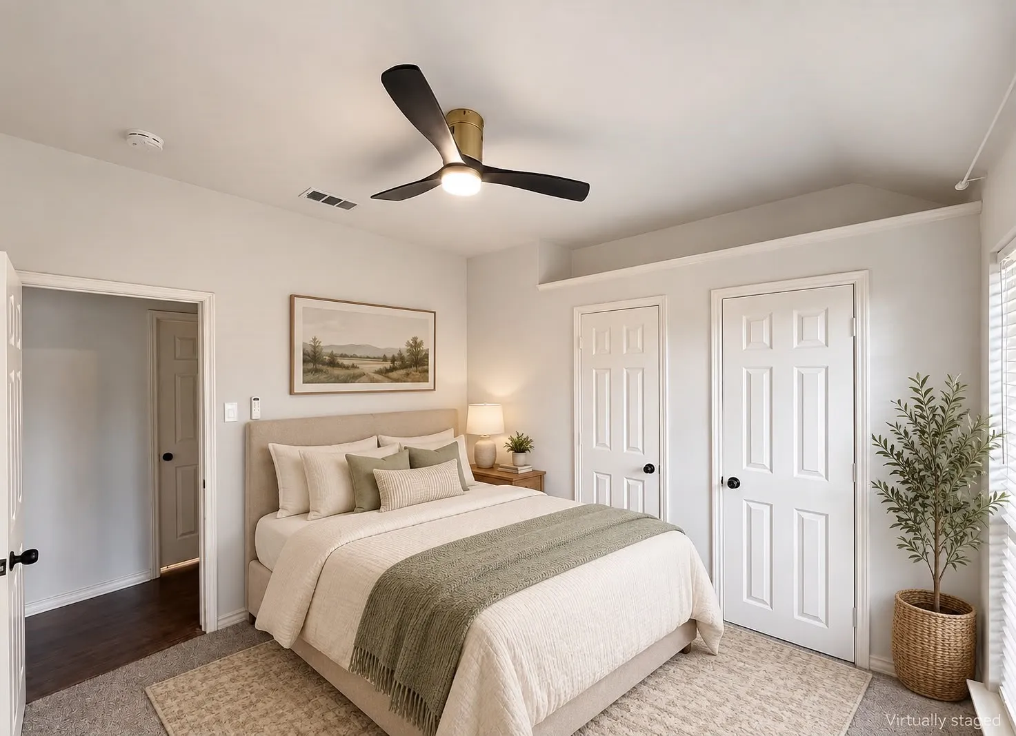 Ceiling fan with integrated lighting, window blinds, multiple panel doors, recessed ceiling feature, and carpeted flooring