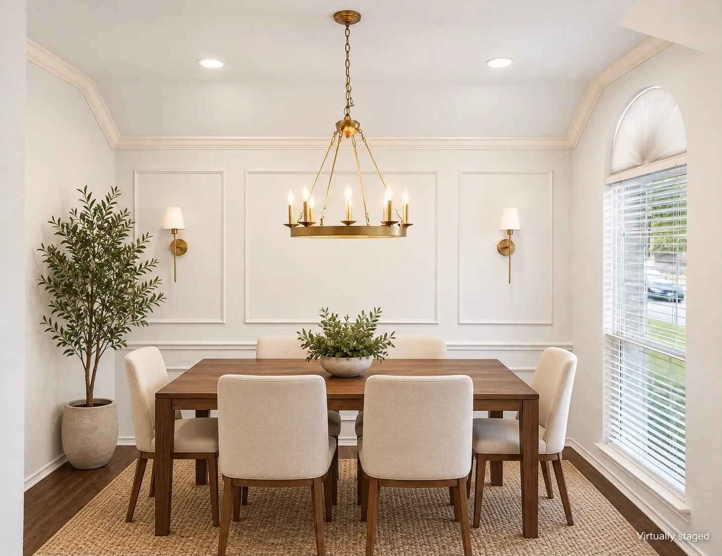 Recessed lighting, crown molding, and wainscoting details complement the wood-finish flooring