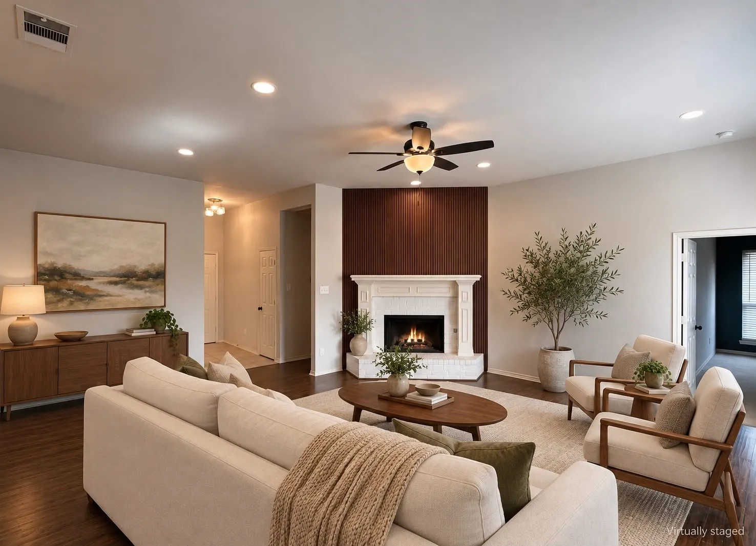 Fireplace with stone surround and wood paneling, wood-finish flooring, recessed lighting, and a ceiling fan