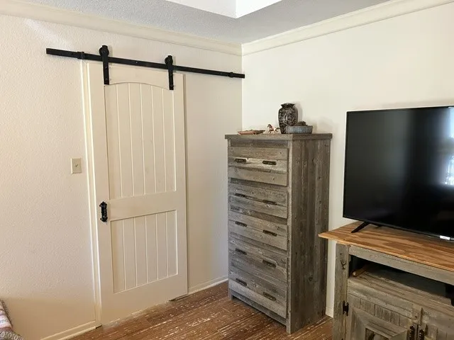 Custom made barn door leading to the fabulous bathroom.