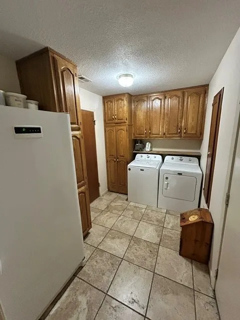 Well just look at this laundry room... would you just look at it?  Huge and plenty of room for a second refrigerator or freezer.