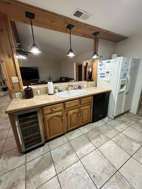 New wine refrigerator makes this space functional and great for entertaining.