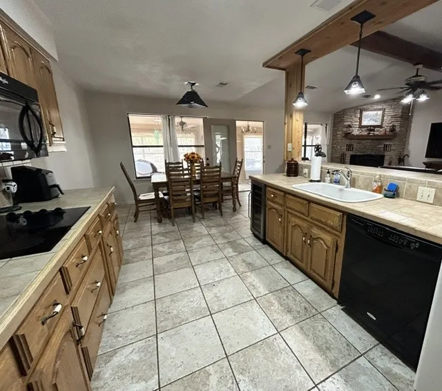 Beautiful tile floors and counter tops.  Hard wood cabinets, and custom beams over the bar.
