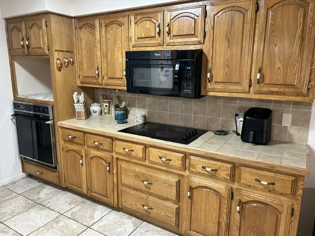 Beautiful cabinets, and a built in space for a coffee bar above the oven.