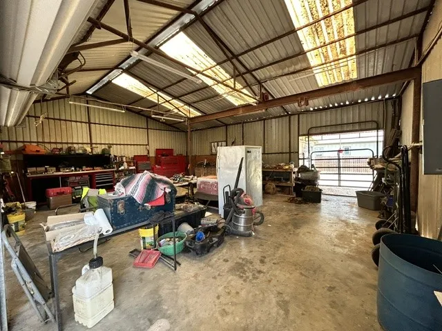 Metal workshop with overhead doors.