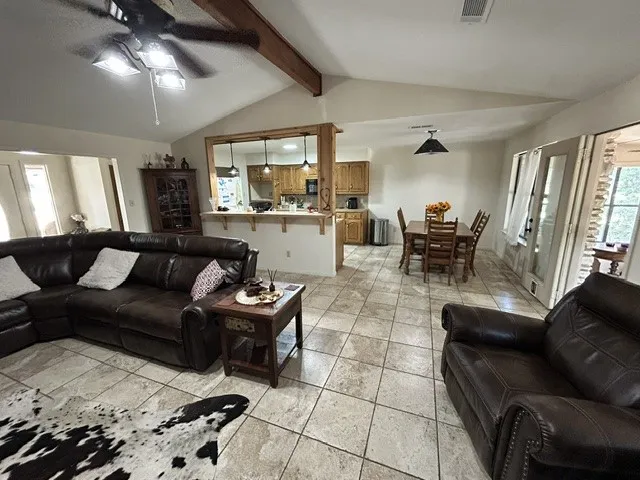 Nice tile flooring, custom wood accents, and lots of open living space.