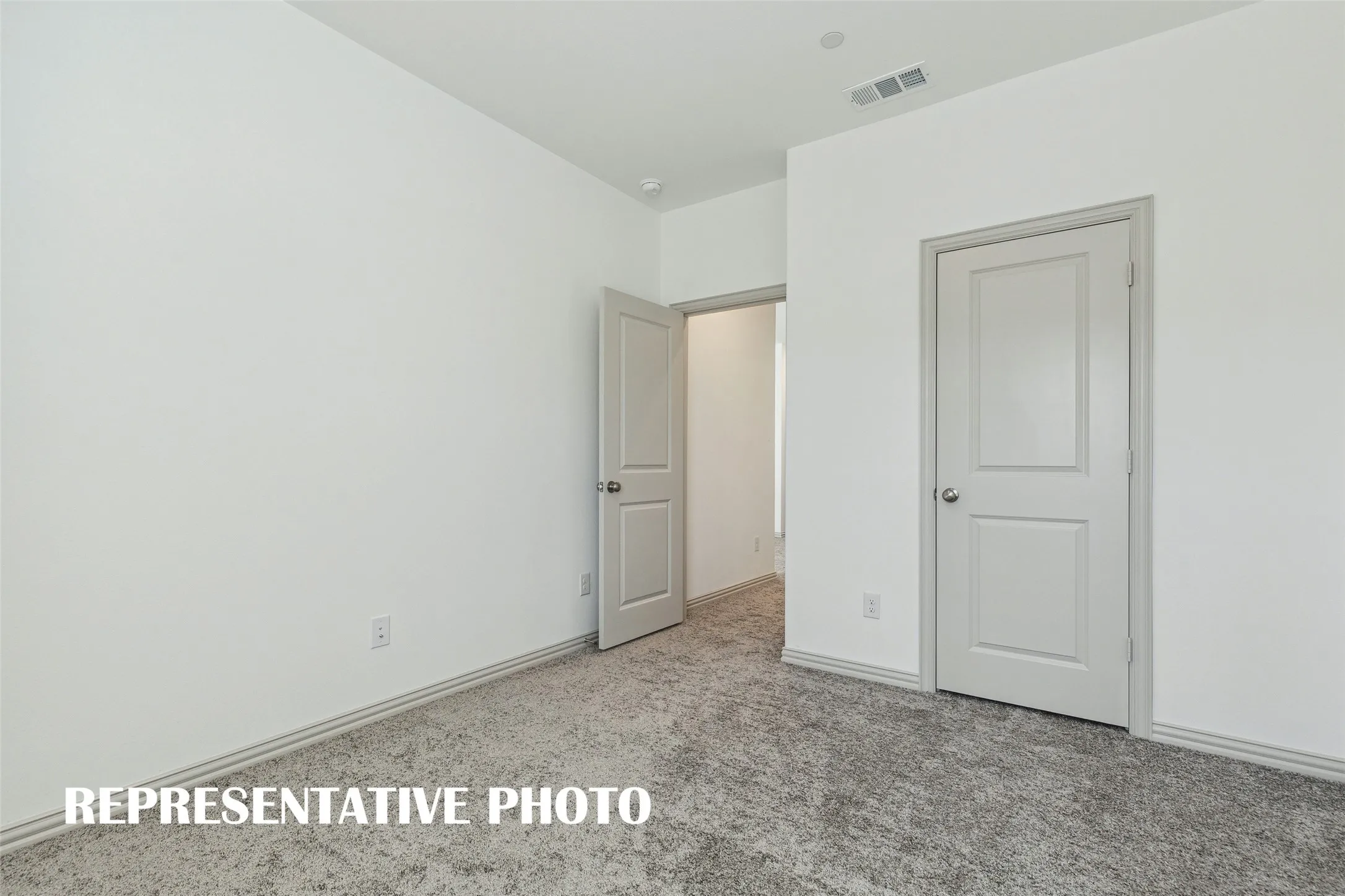 You'll find a nicely sized secondary bedroom with walk-in closet in this great home!  REPRESENTATIVE PHOTO