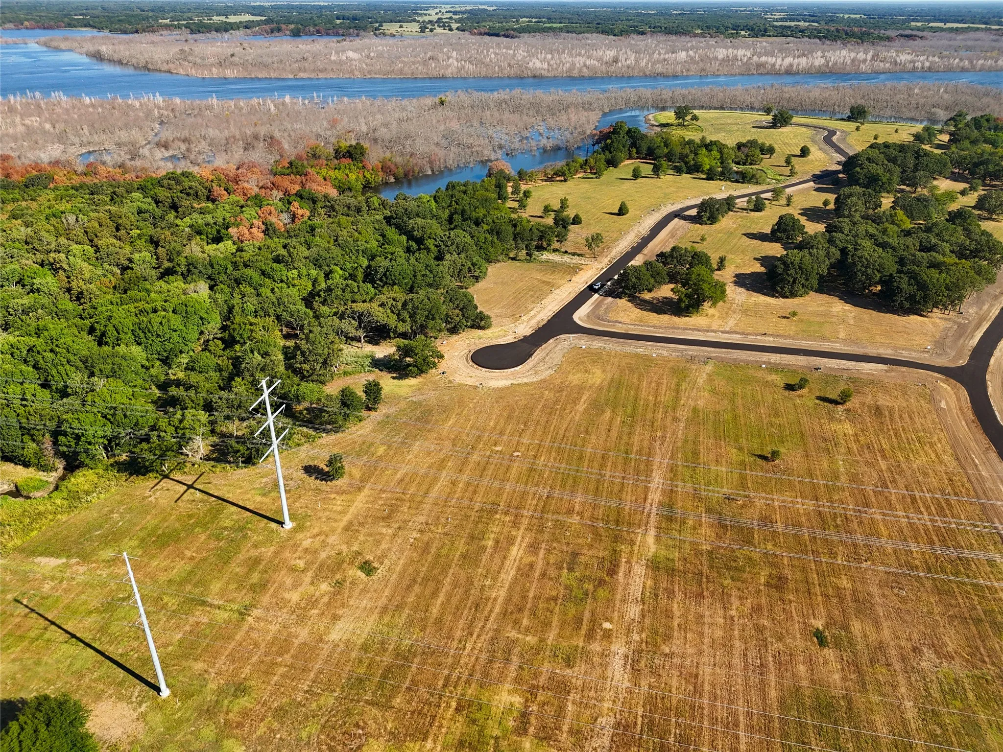 Drone / aerial view featuring a water view and a rural view