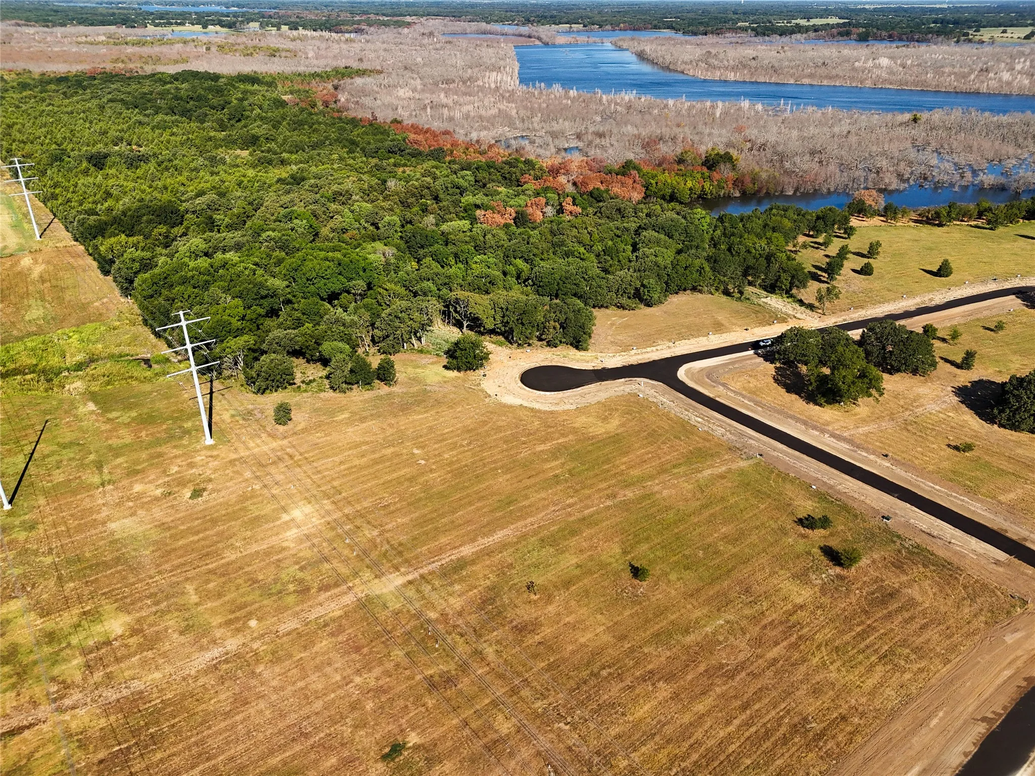 Aerial view with a water view and a rural view