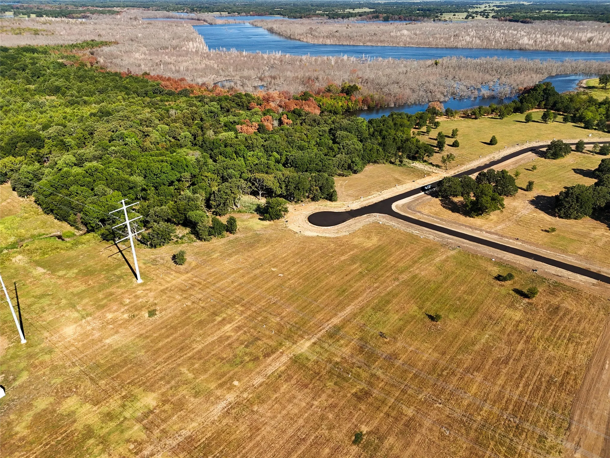 Aerial view with a water view and a rural view