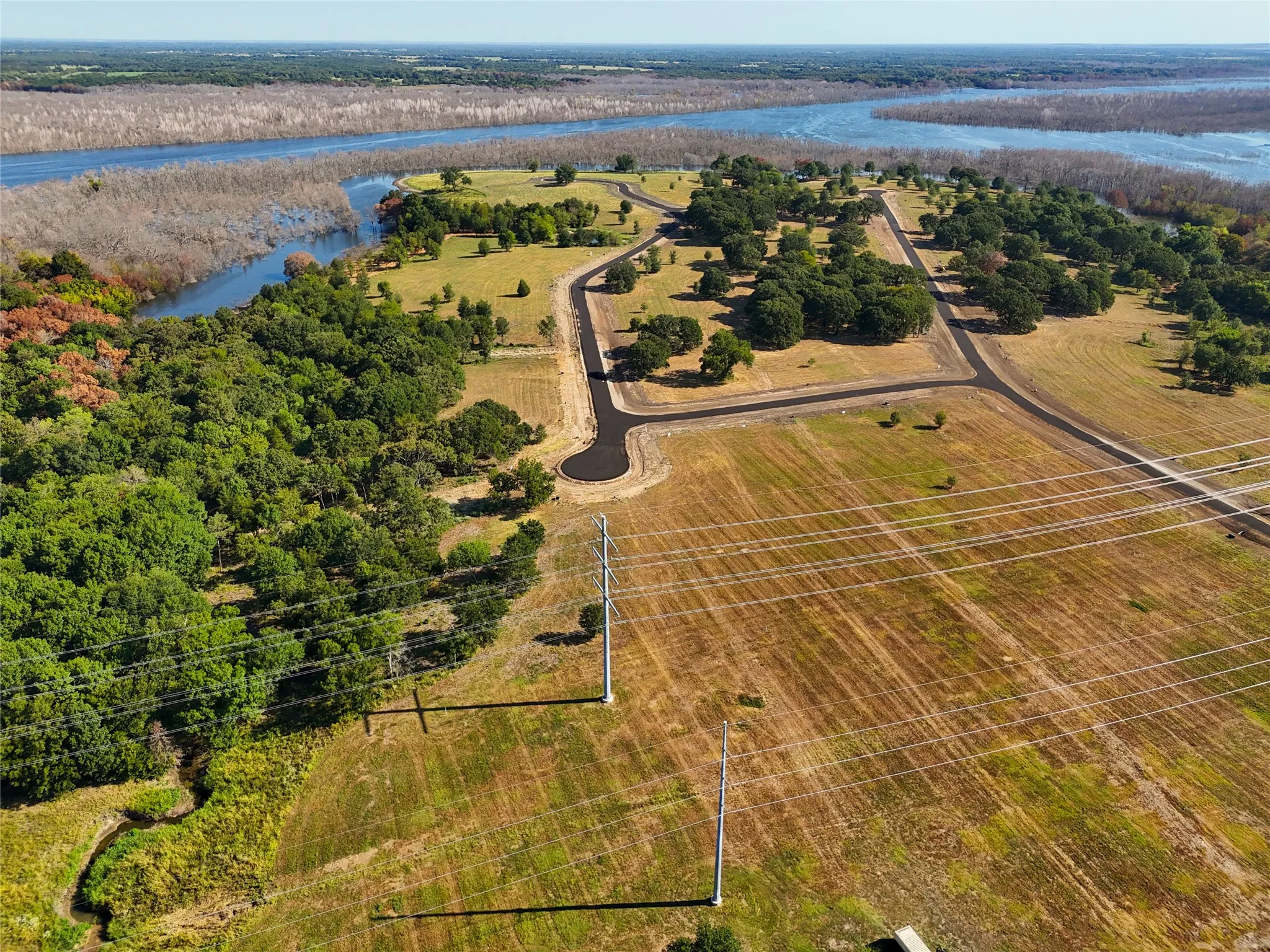 Bird's eye view with a water view and a rural view