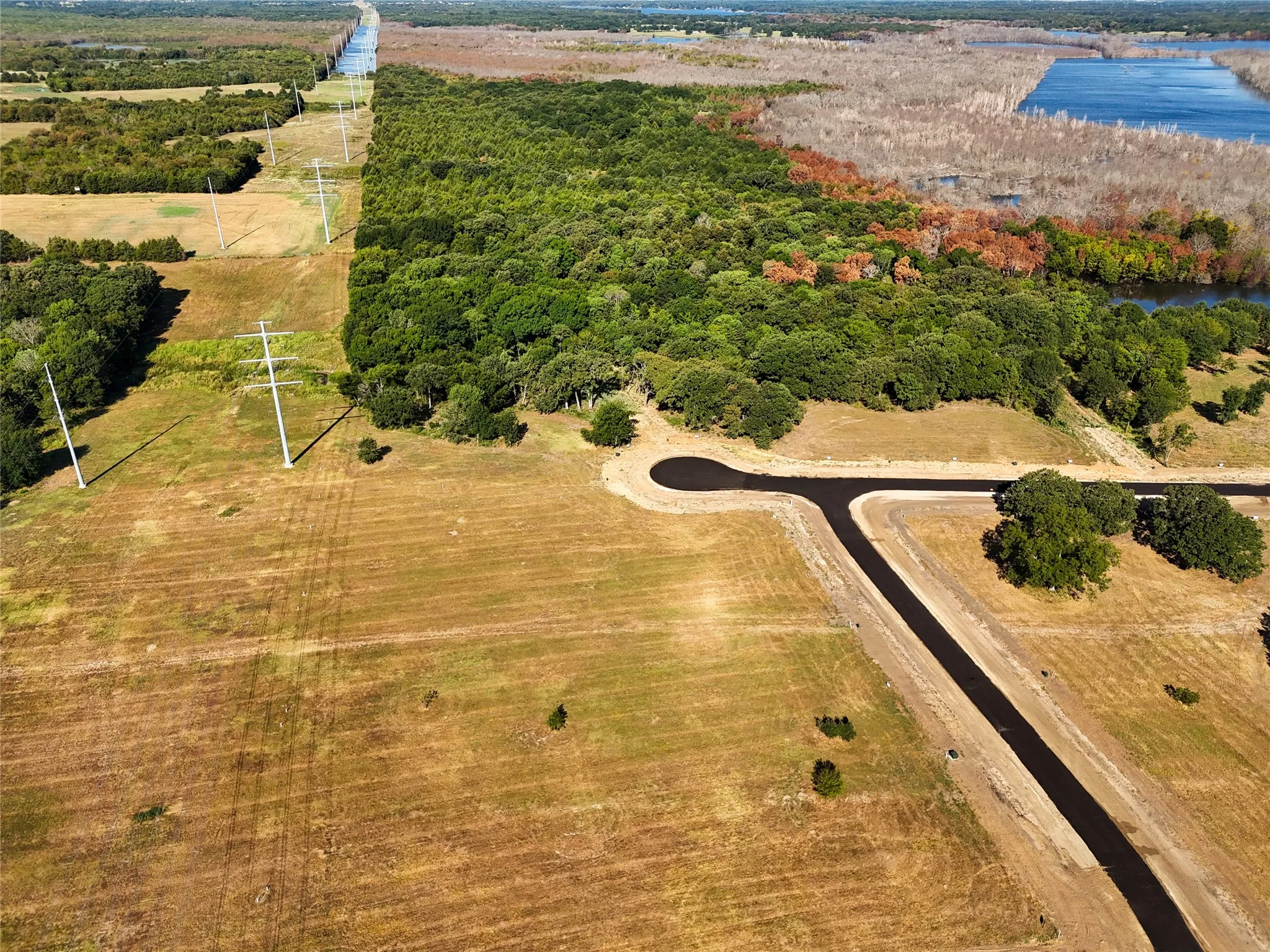 Drone / aerial view featuring a water view and a rural view
