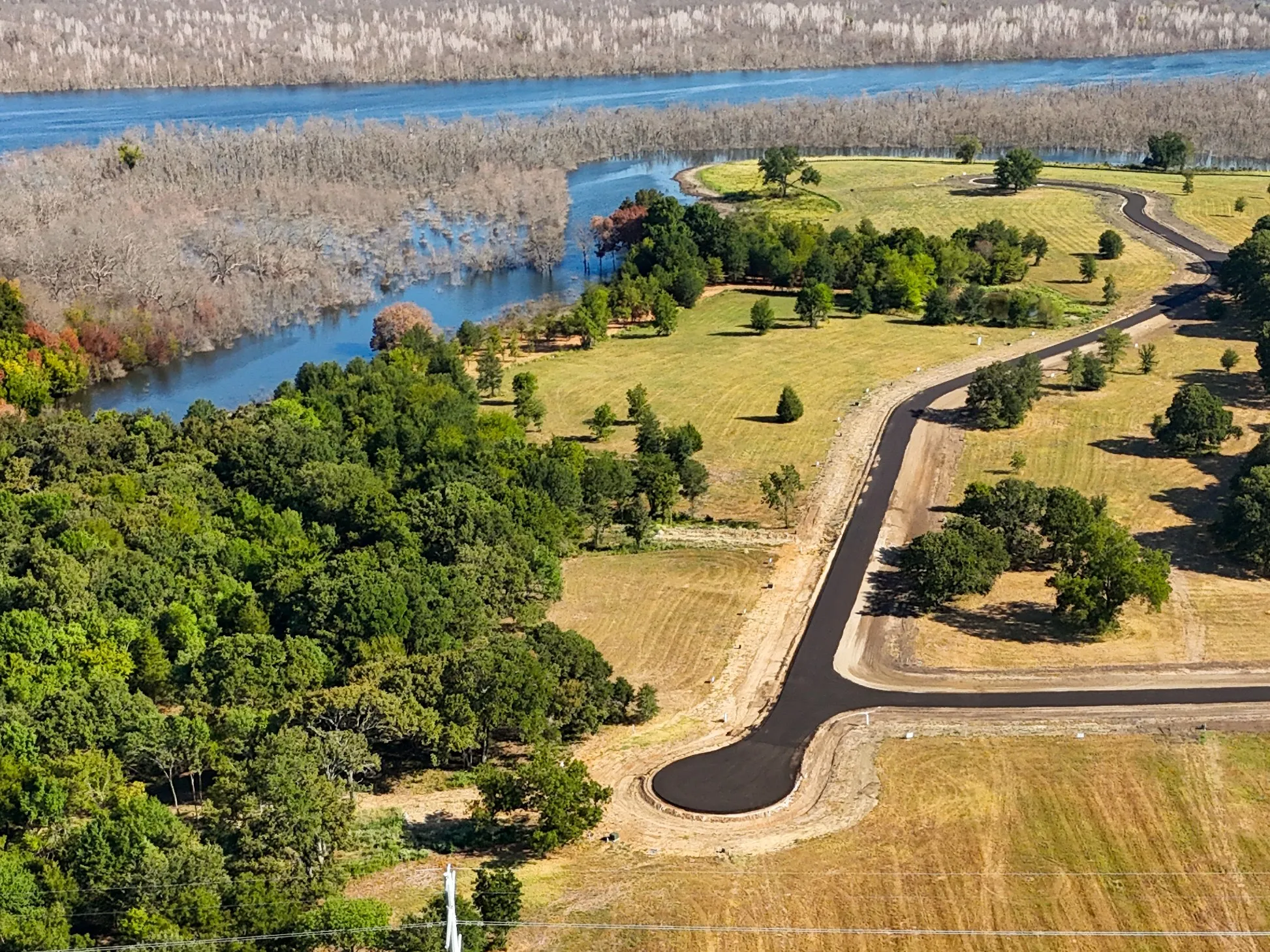 Birds eye view of property with a rural view and a water view