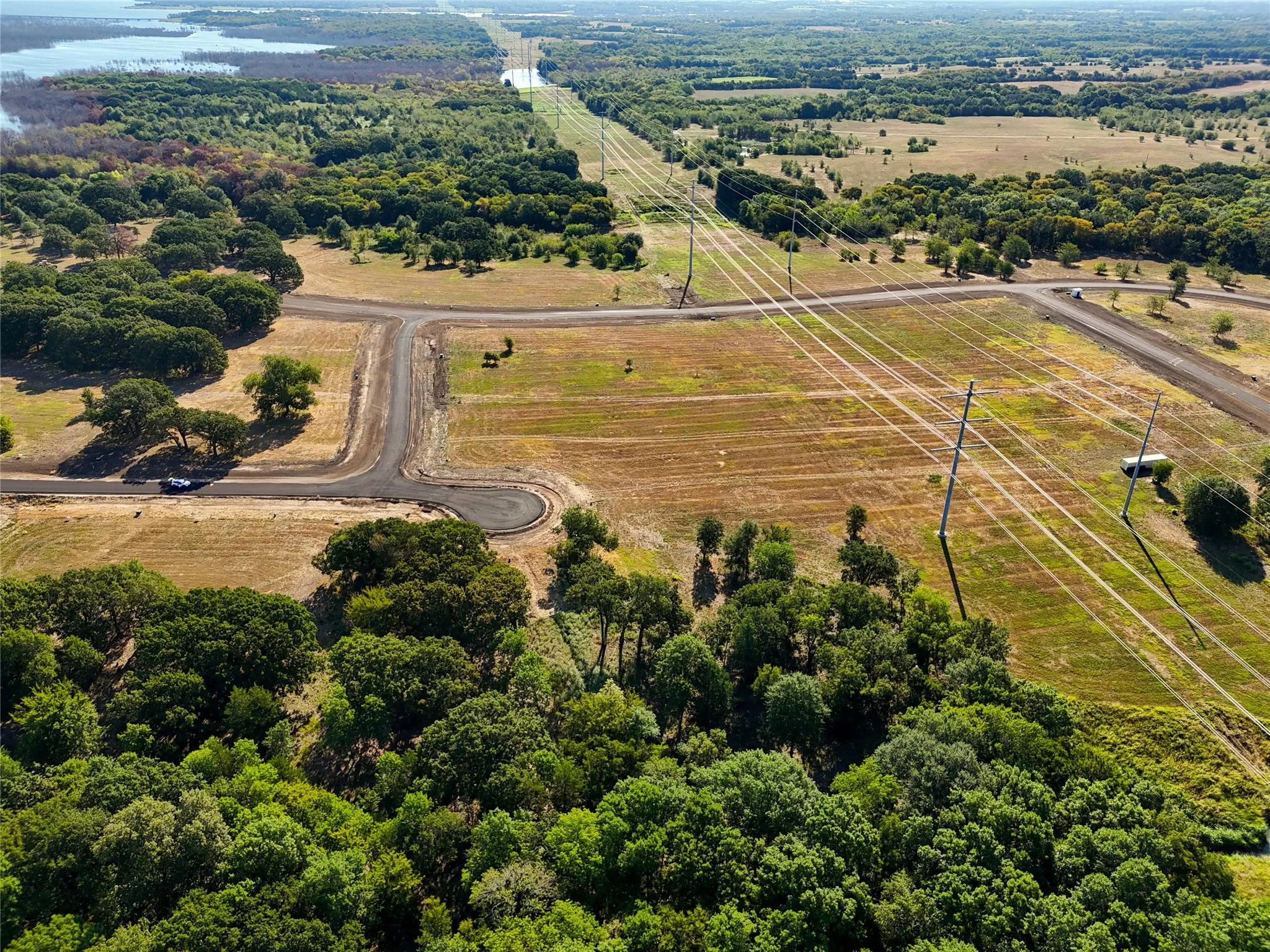 Aerial view with a water view and a rural view