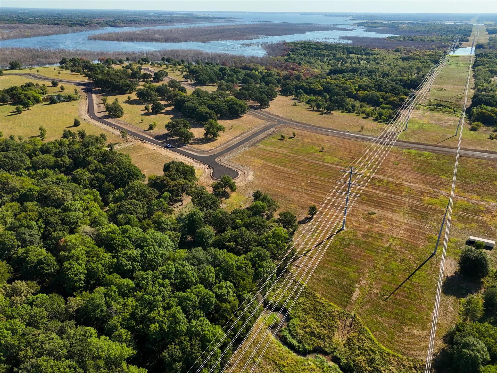 Bird's eye view with a water view and a rural view