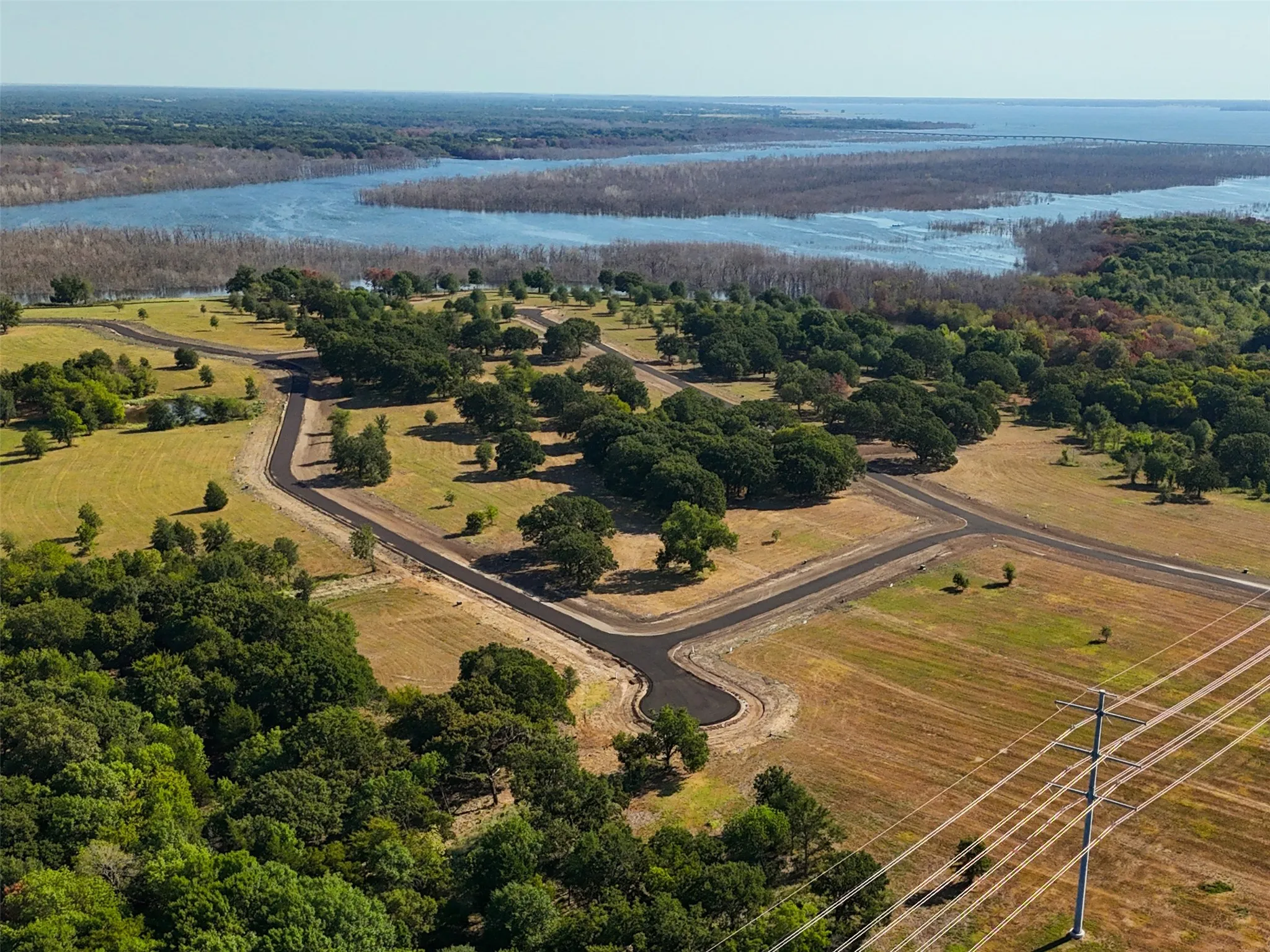 Aerial view featuring a water view and a rural view