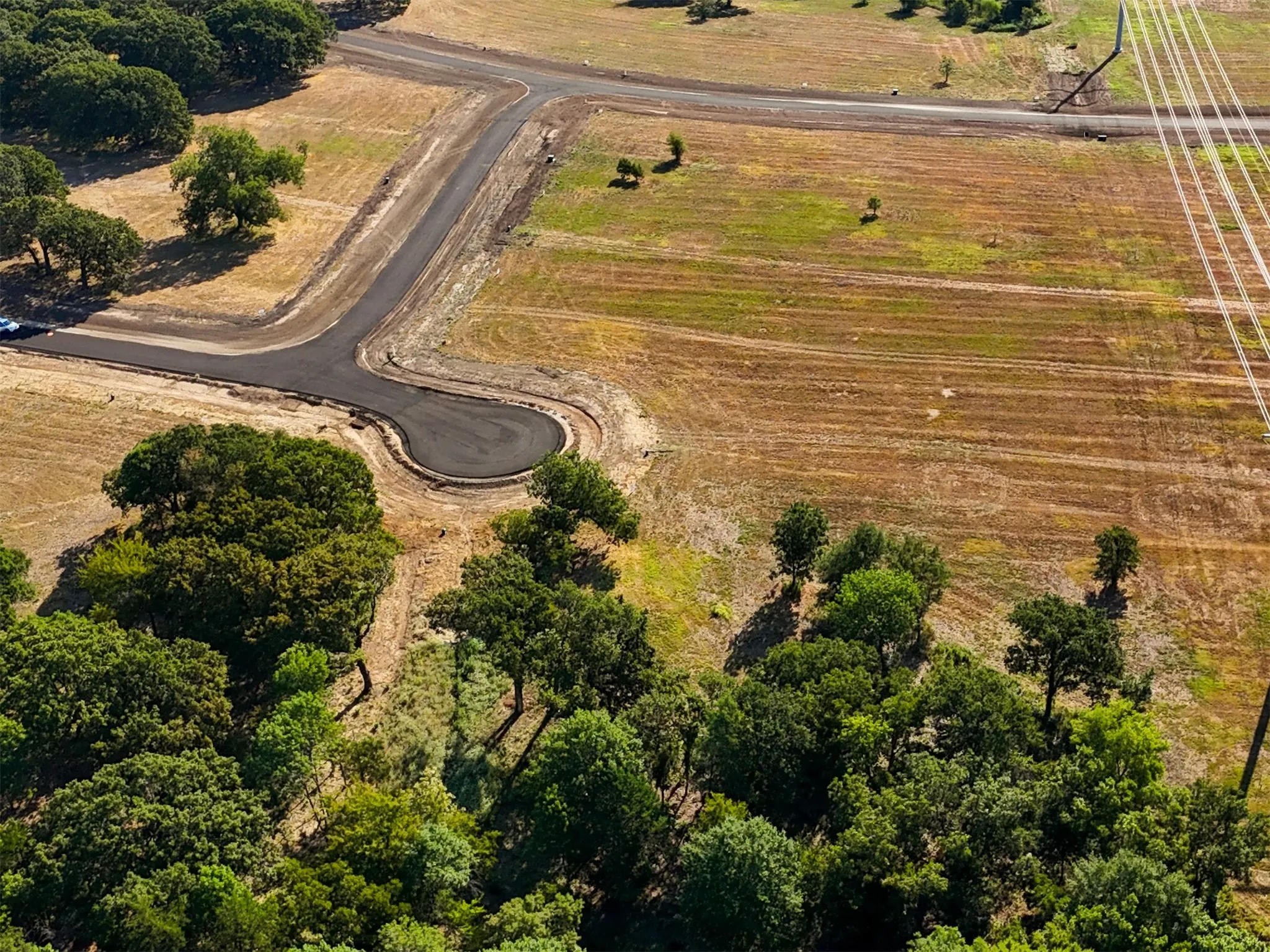 Birds eye view of property featuring a rural view