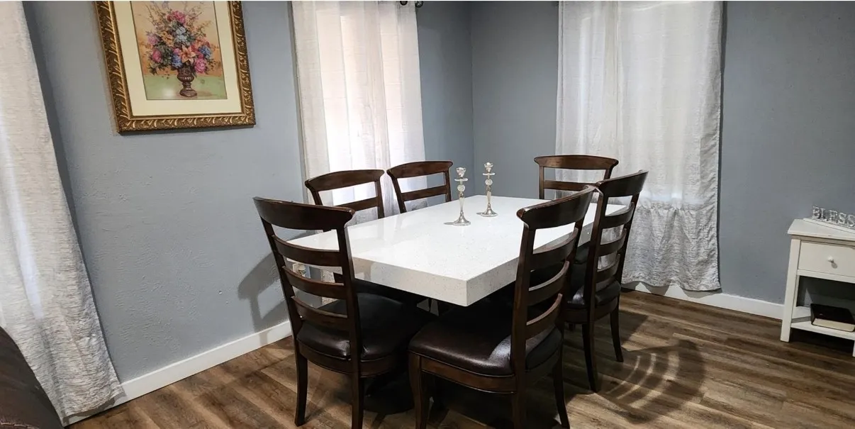 Wood-finish flooring with light gray wall paint