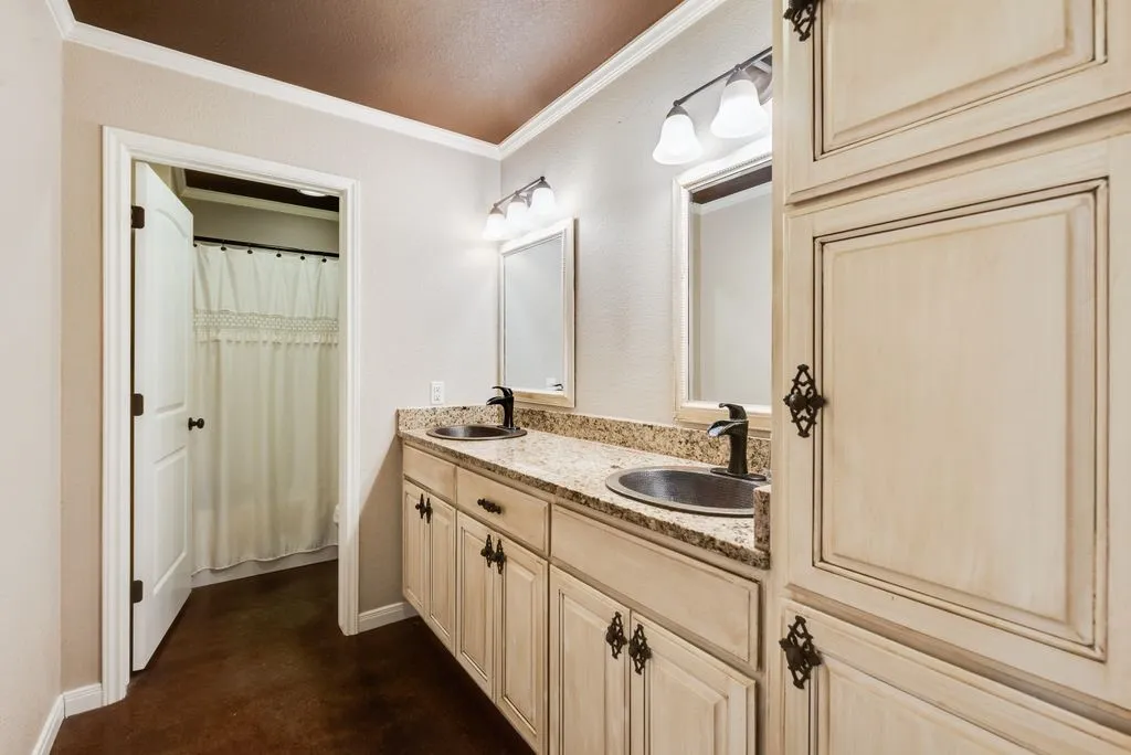 Double vanity with granite-style countertop and integrated sinks