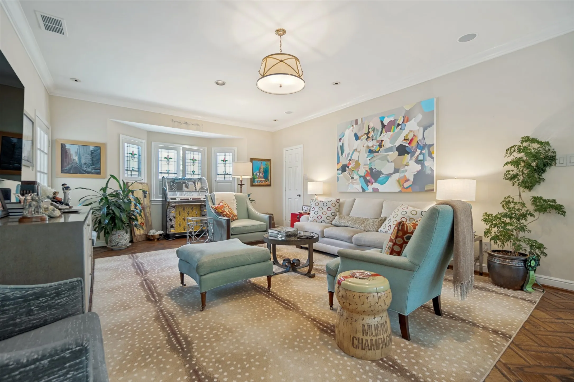 Recessed lighting, crown molding, and wood-finish flooring