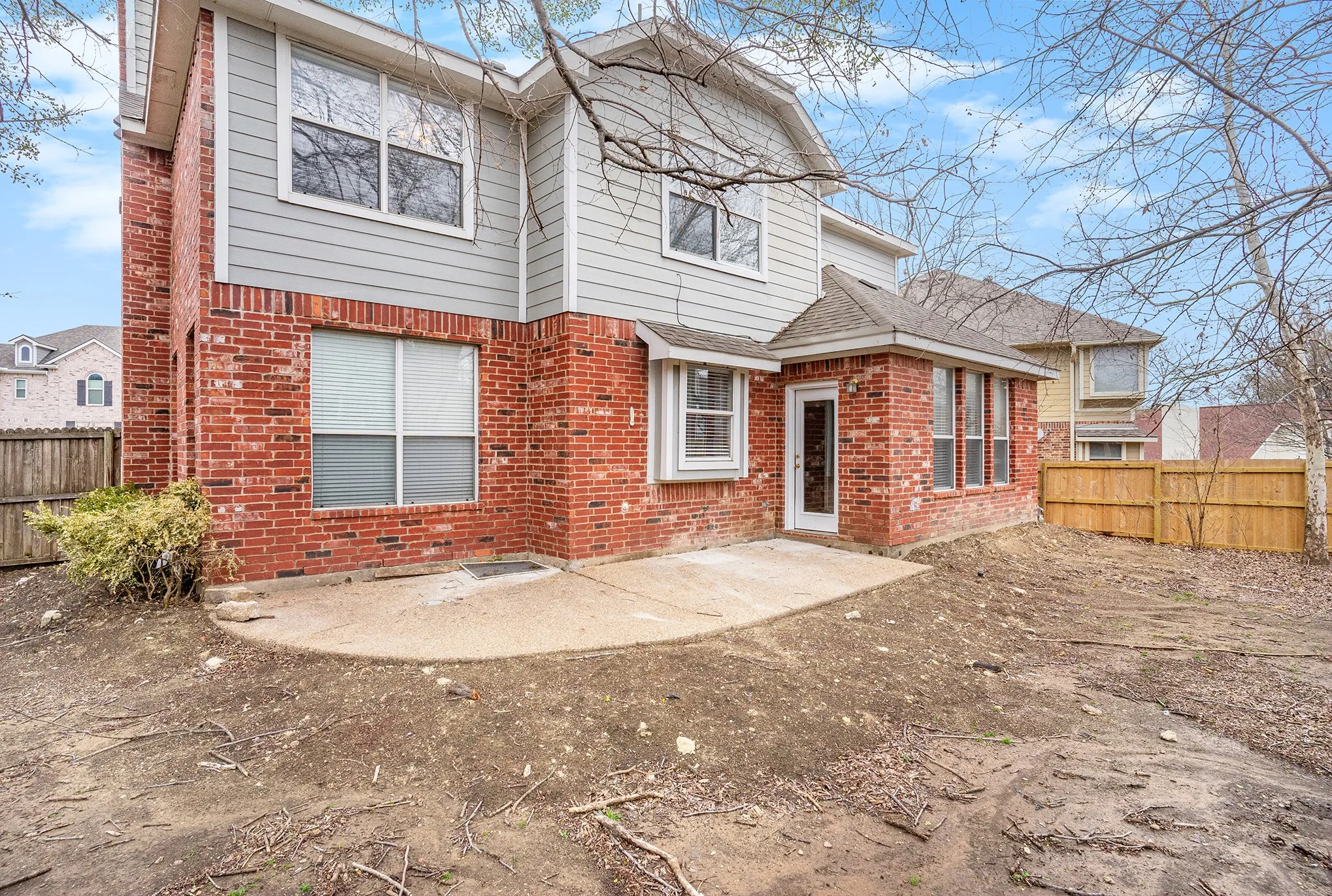 Rear view of property featuring a patio area