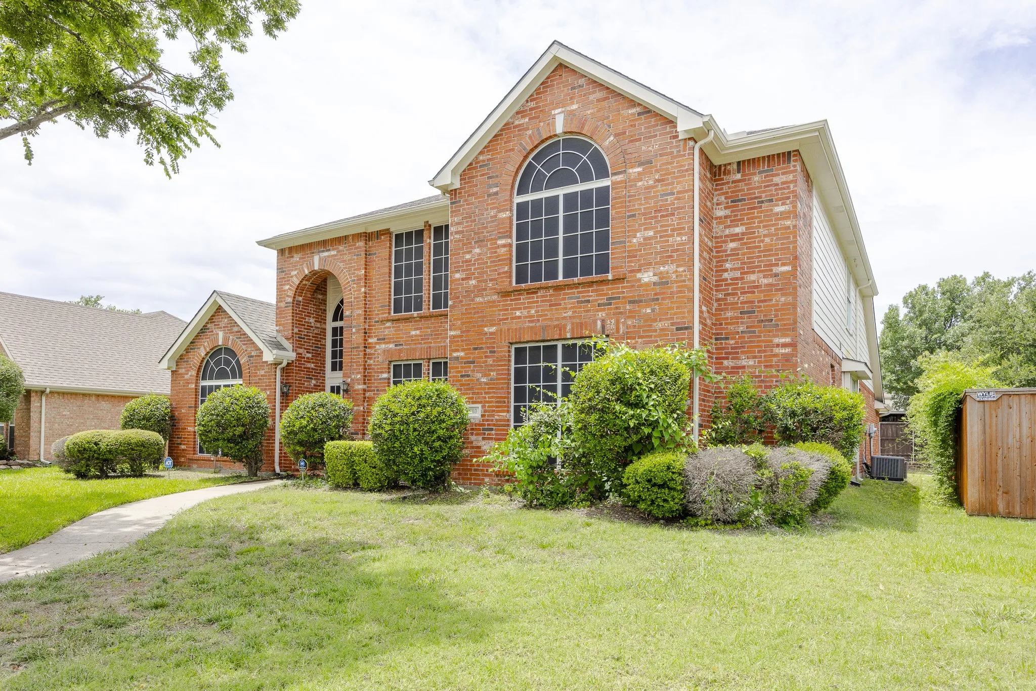 View of front of house with brick siding