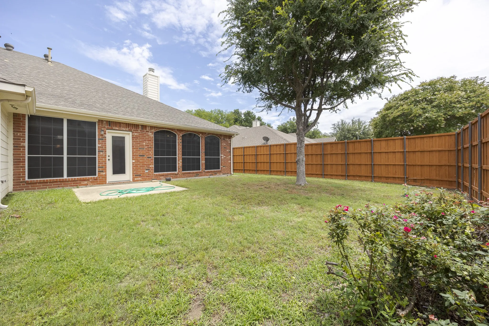 View of fenced backyard