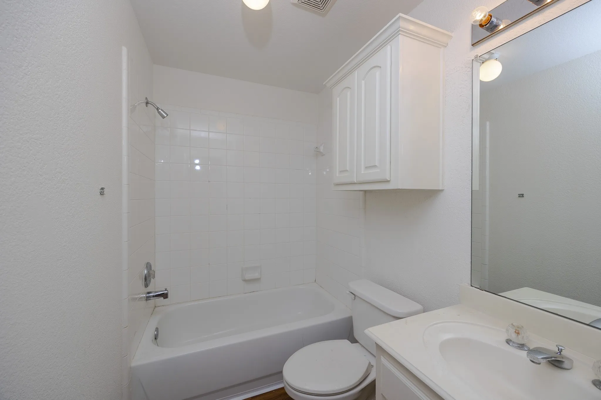 Bathroom featuring vanity and shower / tub combination