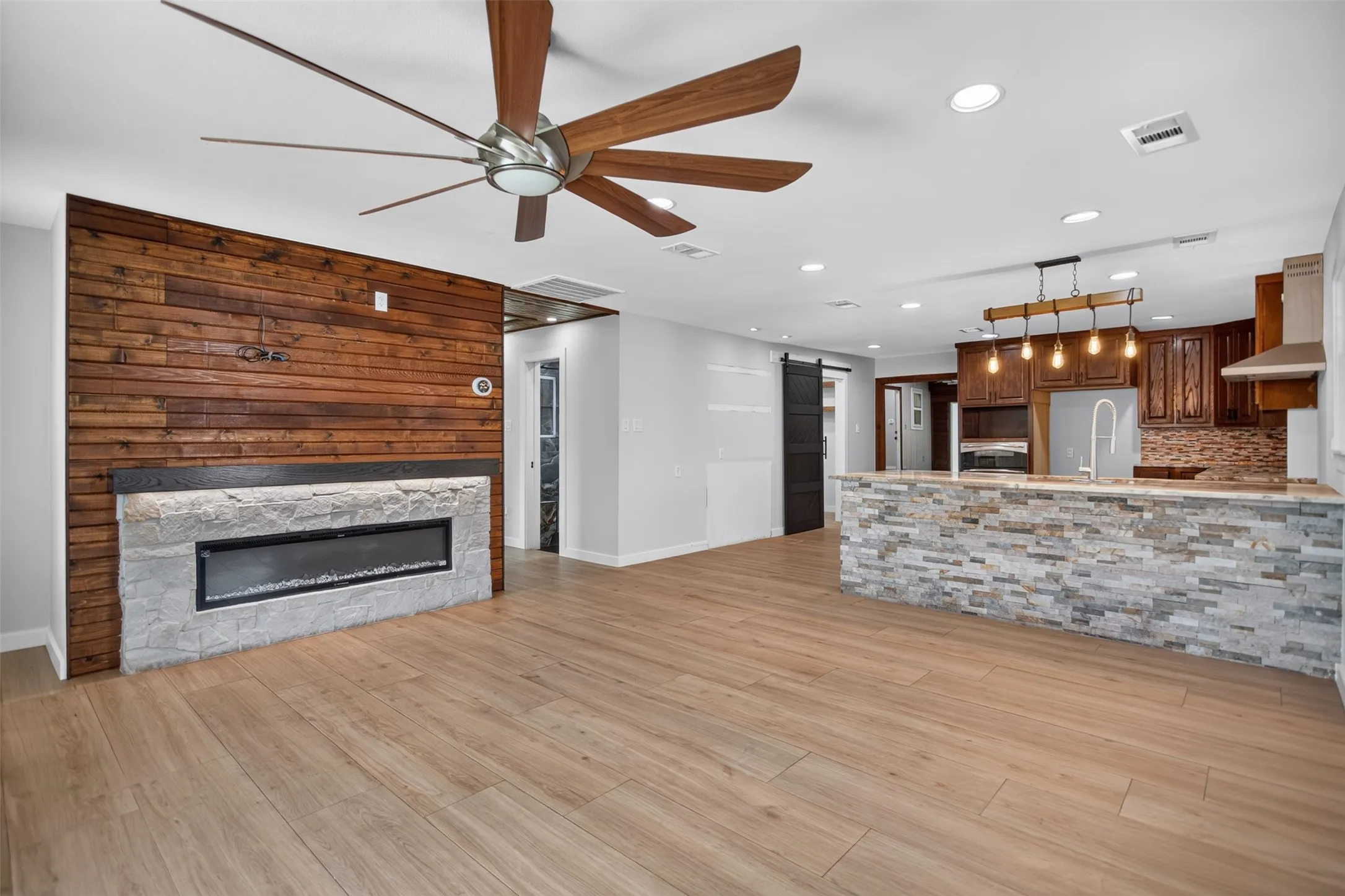 Open Floor Plan.  Modern Electric Fireplace, Ceiling Fan