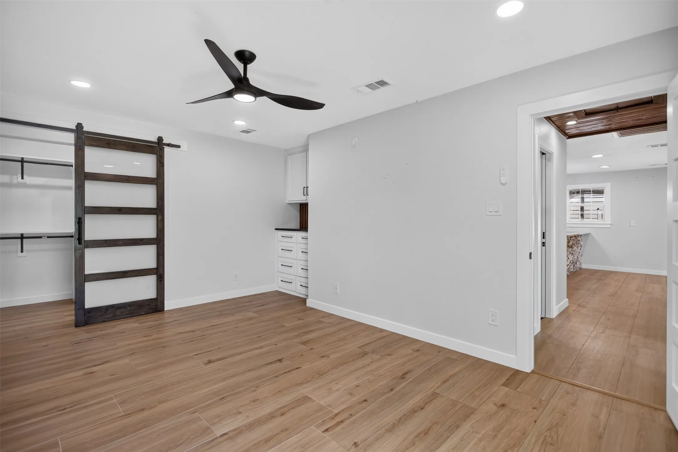 Modern Closet Barn Door and built in cabinets/dresser