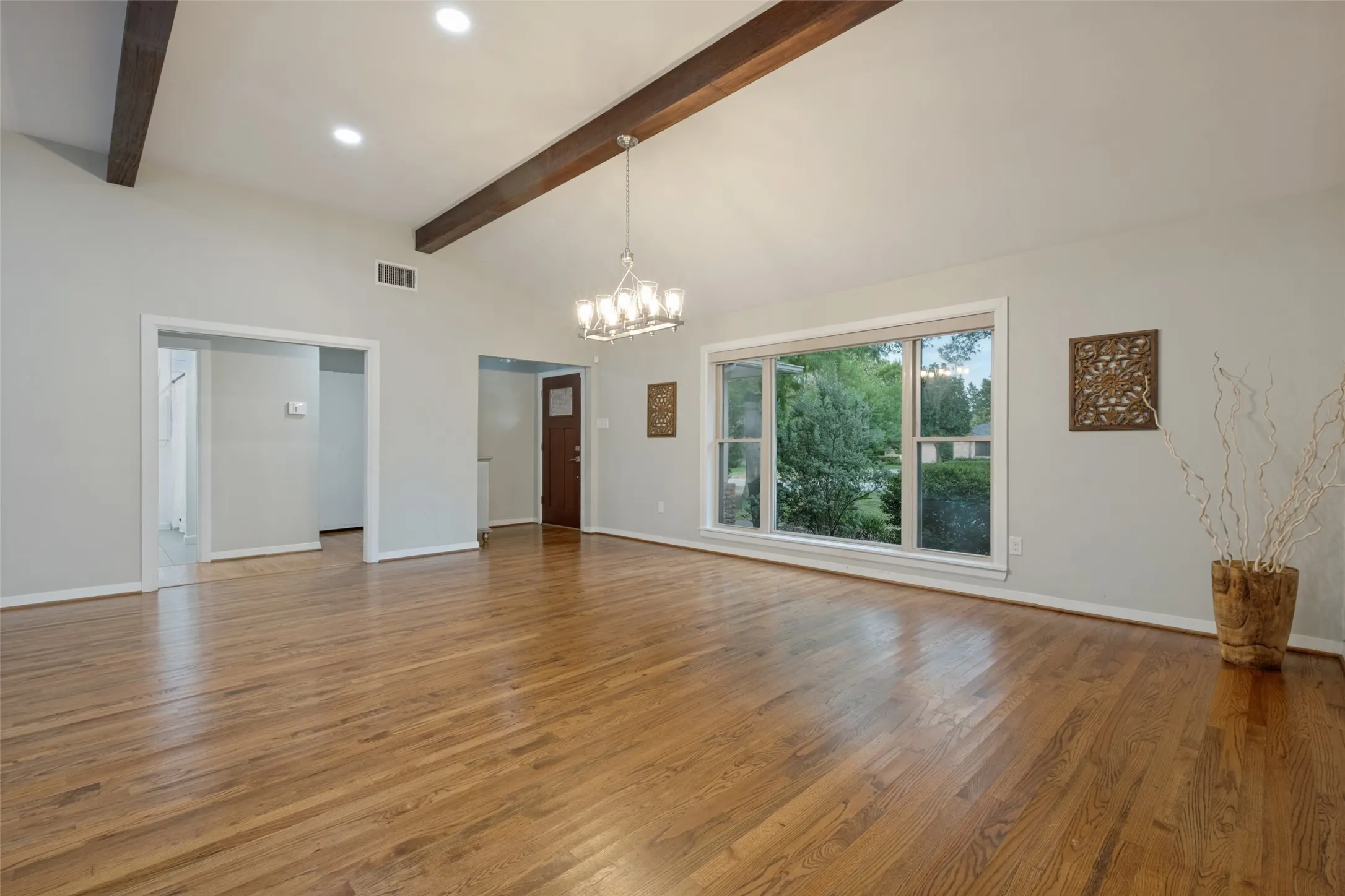 View from corner of Living area towards dining area and front foyer.