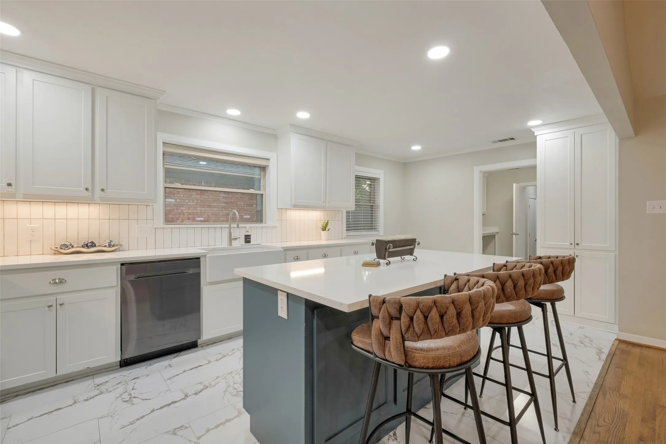 Upgraded Name Brand Appliances with gas stovetop, convection oven with warmer, vented hood, high end quiet dishwasher, beautiful white ceramic farm sink.