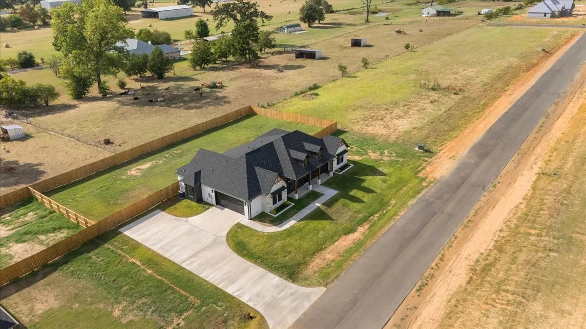 White siding exterior with dark gray roofing