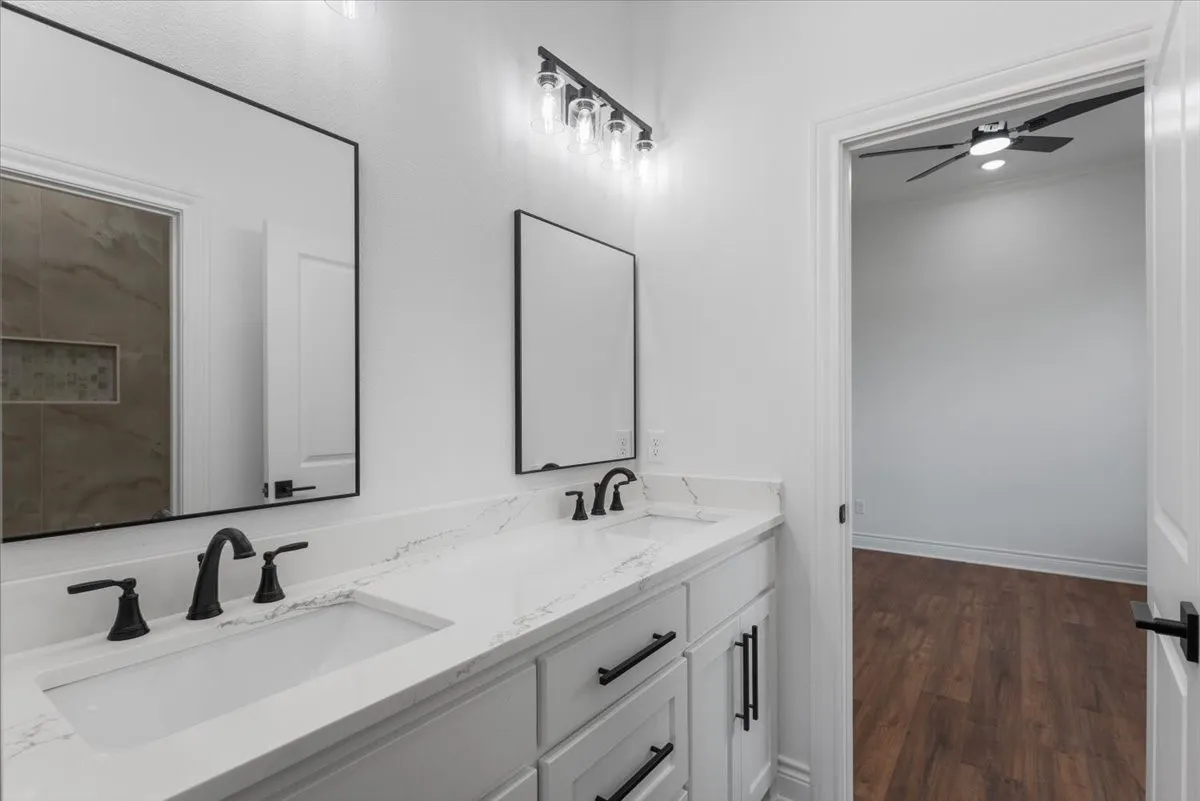 Dual vanity with integrated sinks and a stone-finish countertop