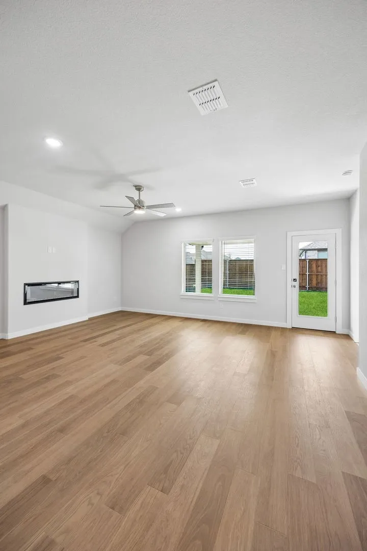 Living Room in the Oscar home plan by Trophy Signature Homes – REPRESENTATIVE PHOTO