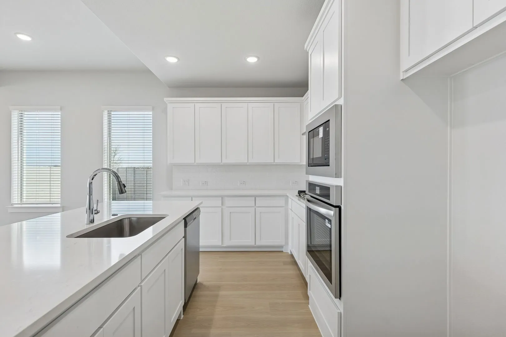 Kitchen in the Stanley II home plan by Trophy Signature Homes – REPRESENTATIVE PHOTO