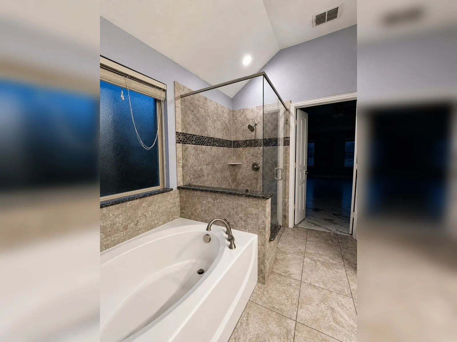 Soaking tub with deck-mounted faucet
