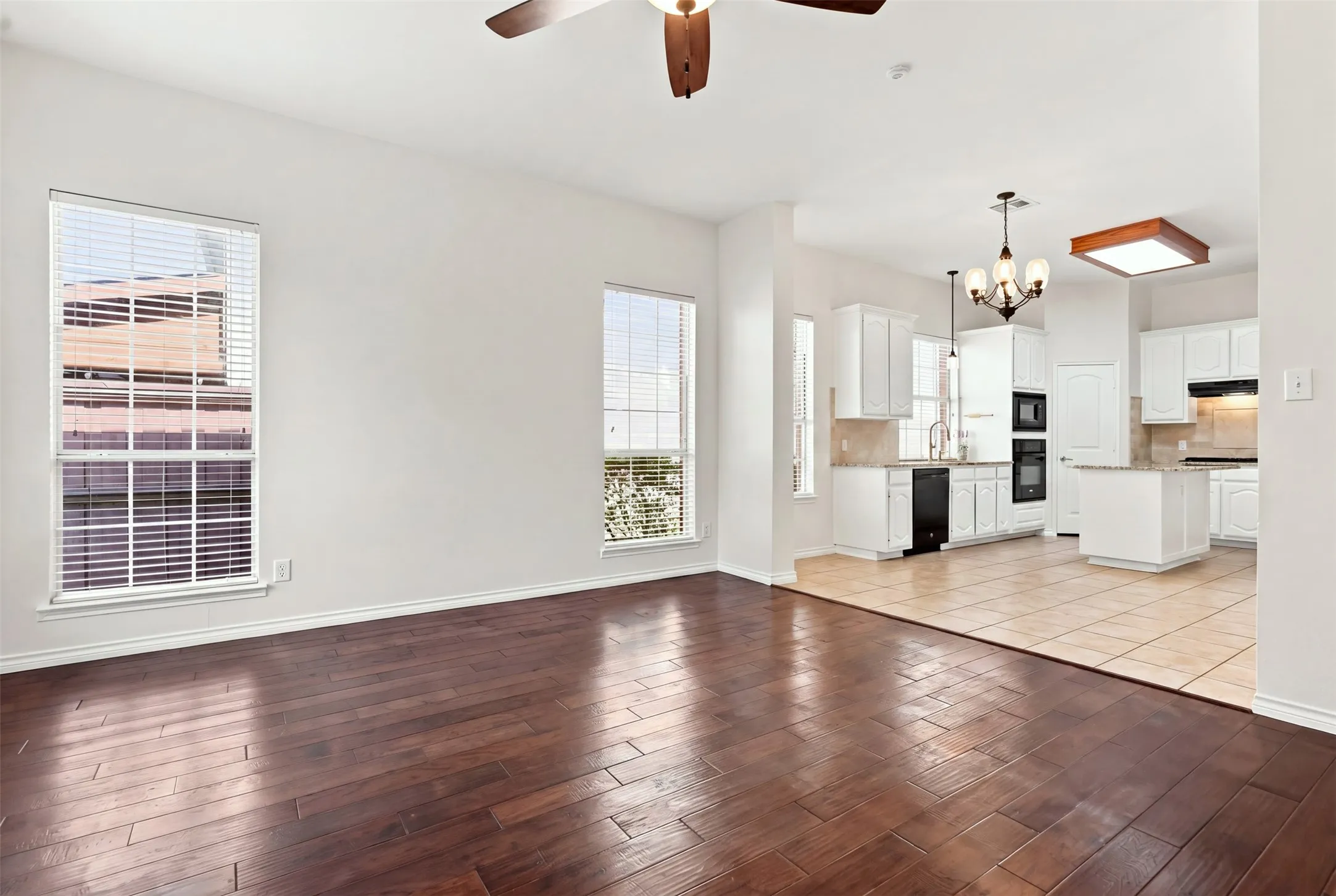 Living room opens to the nook and kitchen
