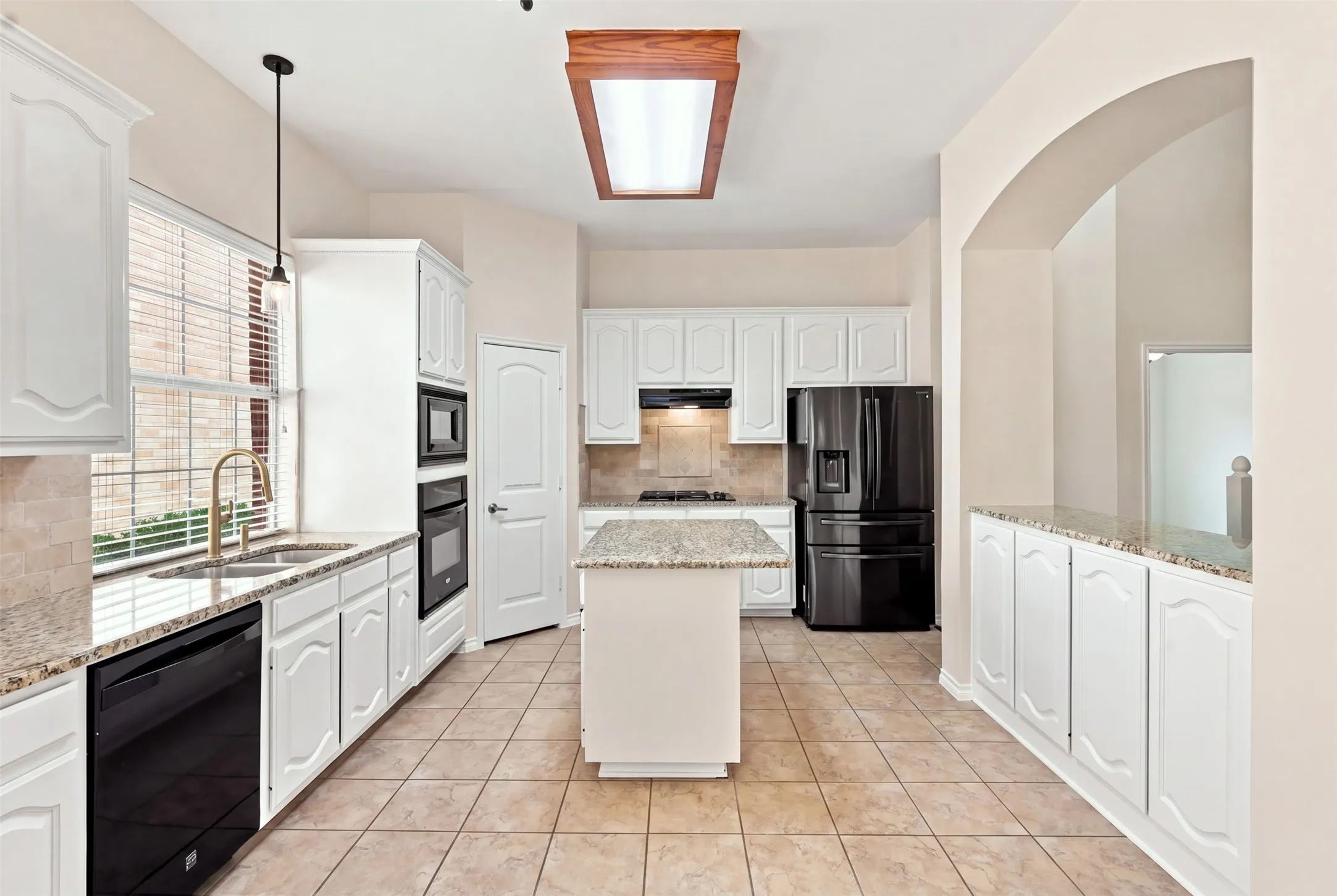 Lolts of storage in this awesome kitchen. Cabinets everywhere!