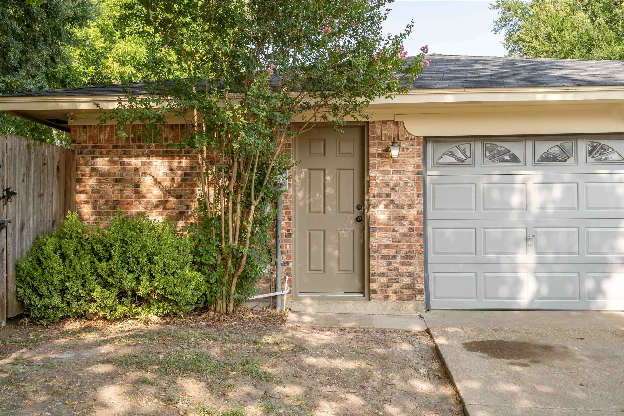 Side entry double car garage with pass through door to the side yard.