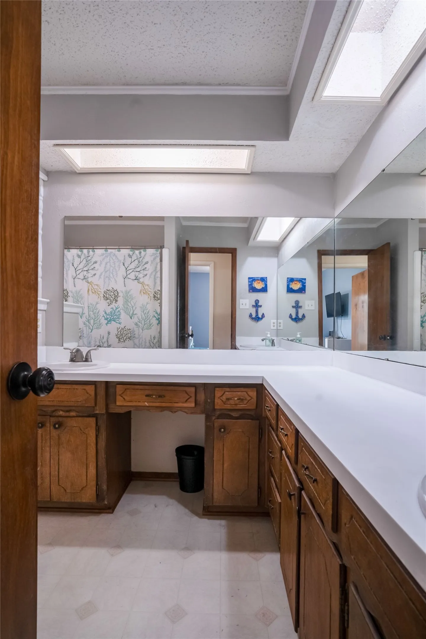 A bathroom big enough to cut down the morning fight for mirror and vanity space.